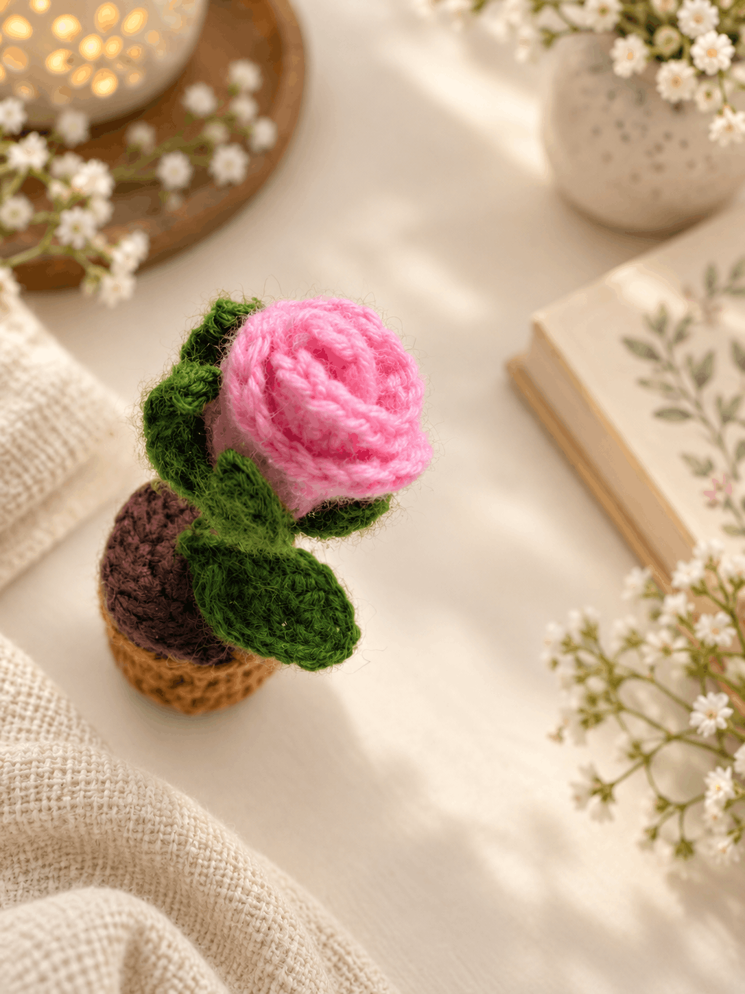 The rolled pink rosebud seen from above, showing the spiral of the petals