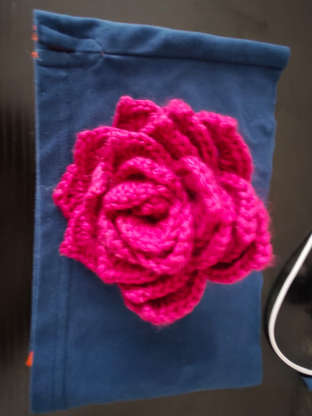 Magenta rose on pouch